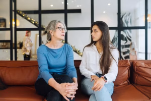 young-woman-visiting-grandmother-home-women-talk-6ec8a38f12b97a257213281c19ff50b5