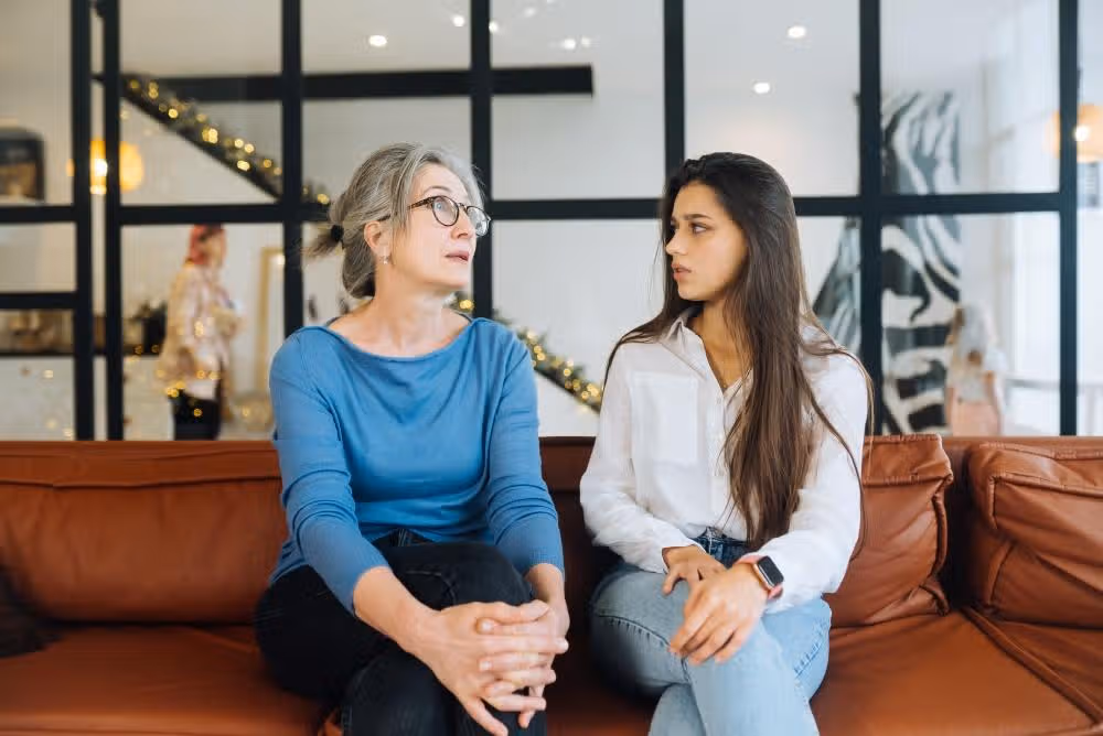 young-woman-visiting-grandmother-home-women-talk-6ec8a38f12b97a257213281c19ff50b5